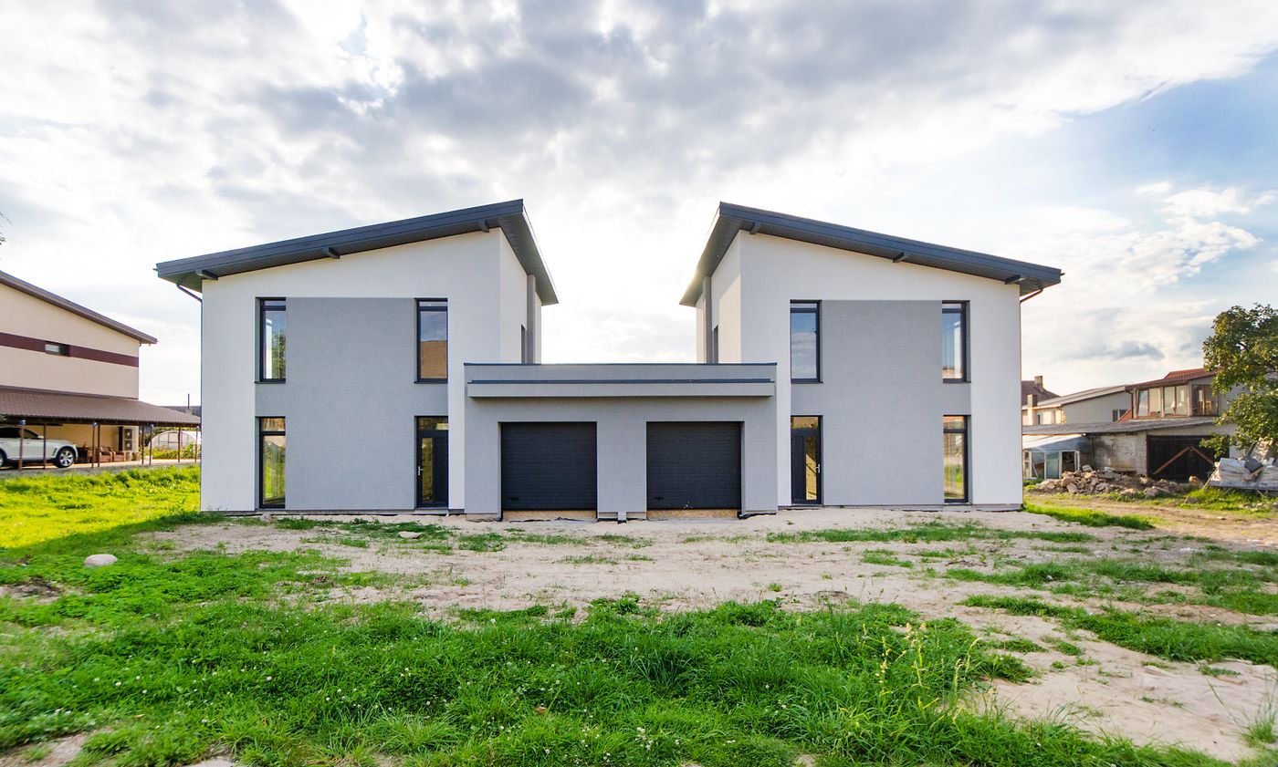 Symmetrical two-storey modern house facade with clean architectural lines