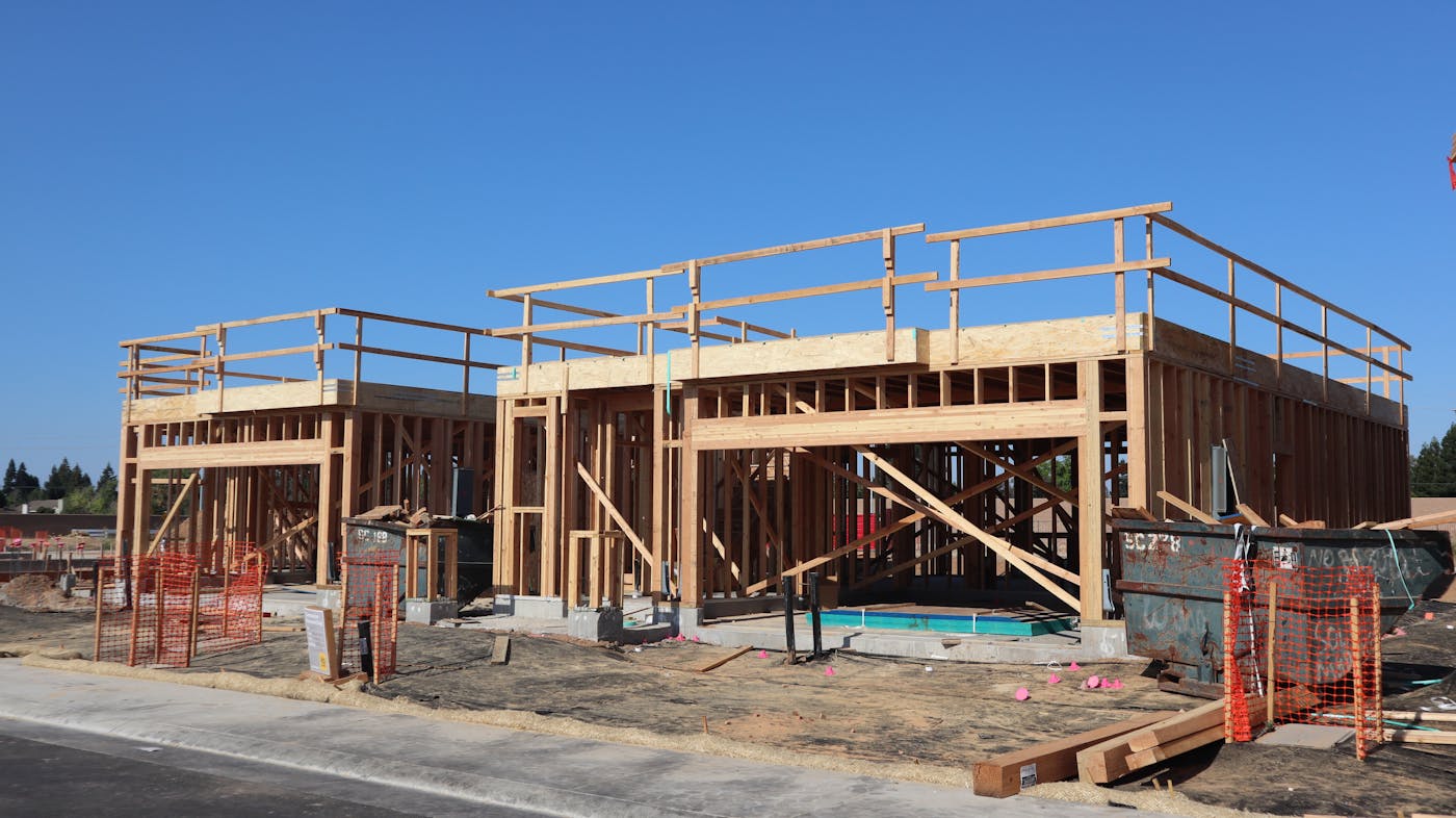 New residential home under construction showing wooden framing and build progress