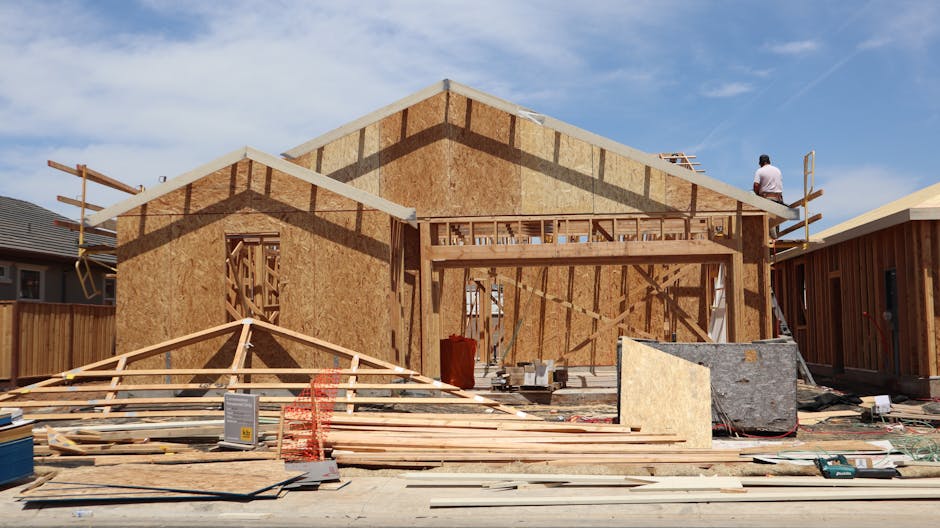 New custom home under construction framing stage with bushland surroundings