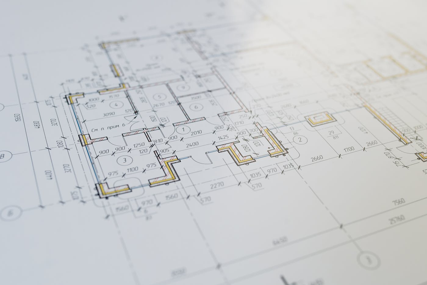 Town planner reviewing site zoning maps and development assessment documents