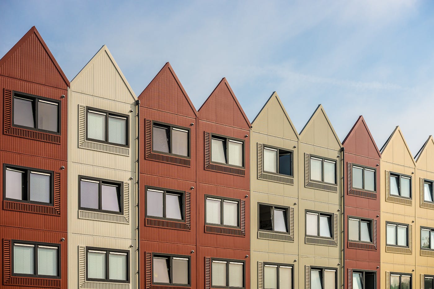 Row of modern residential buildings showcasing quality construction and architectural design