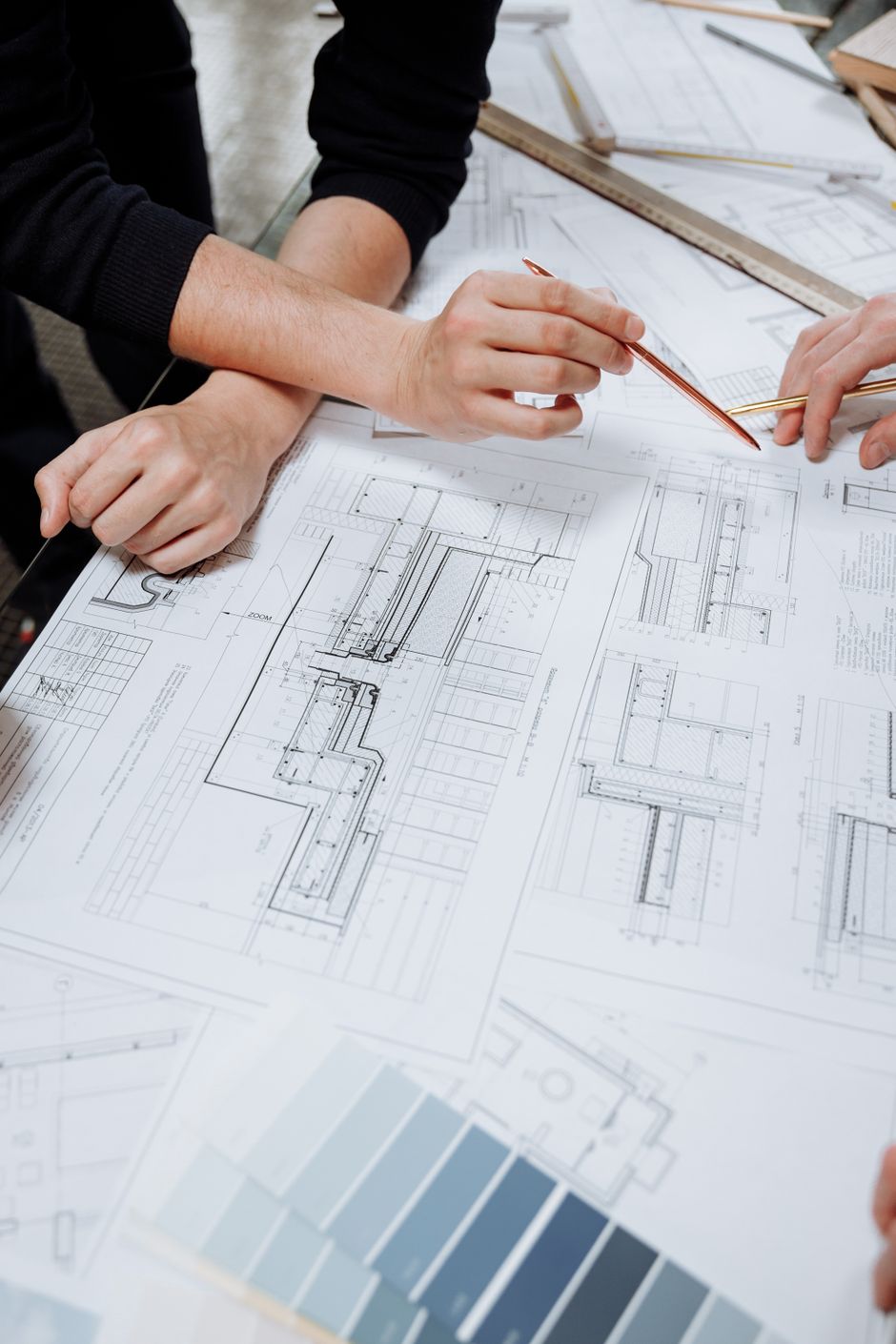 Architect reviewing schematic diagrams and planning documents
