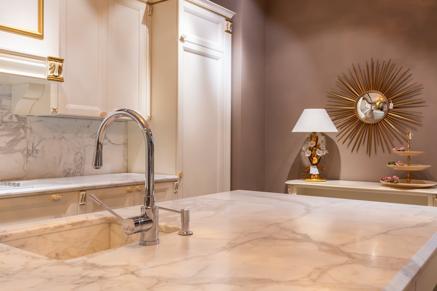 Renovated kitchen interior with marble benchtops and modern fixtures