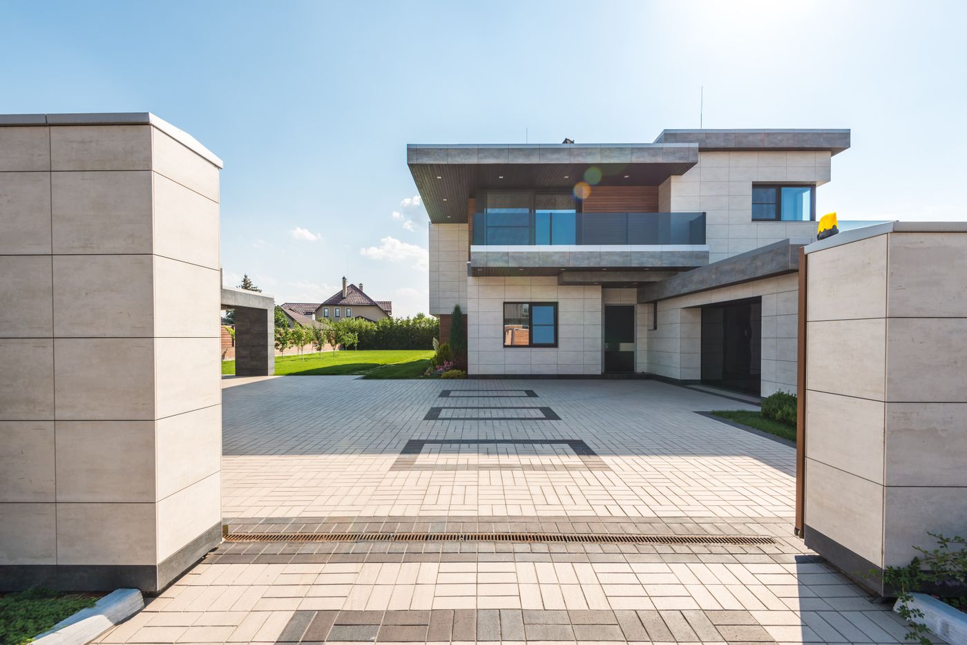 Contemporary two-storey home with paved driveway and garden landscaping