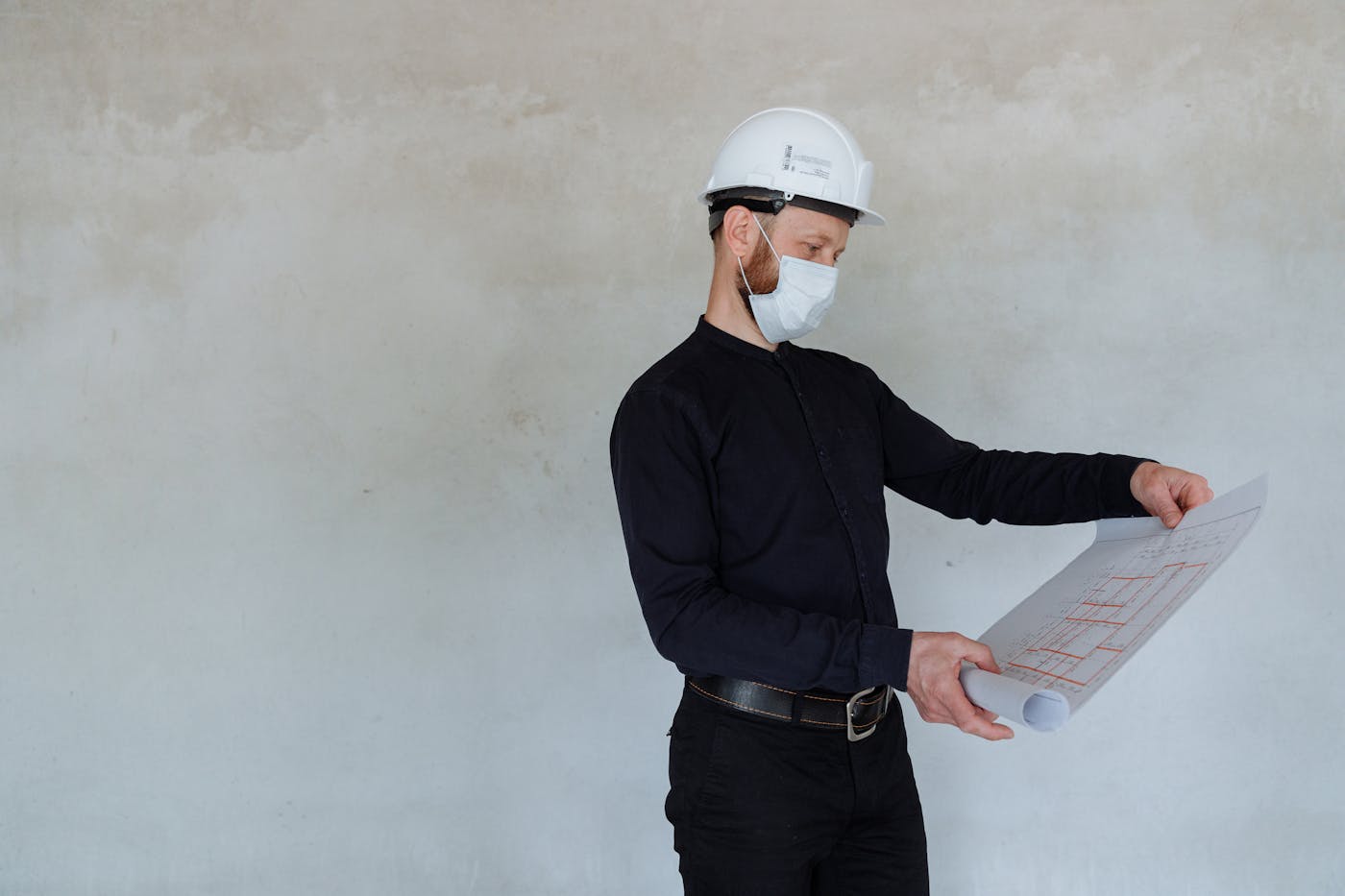 Architect reviewing development application plans and site documents