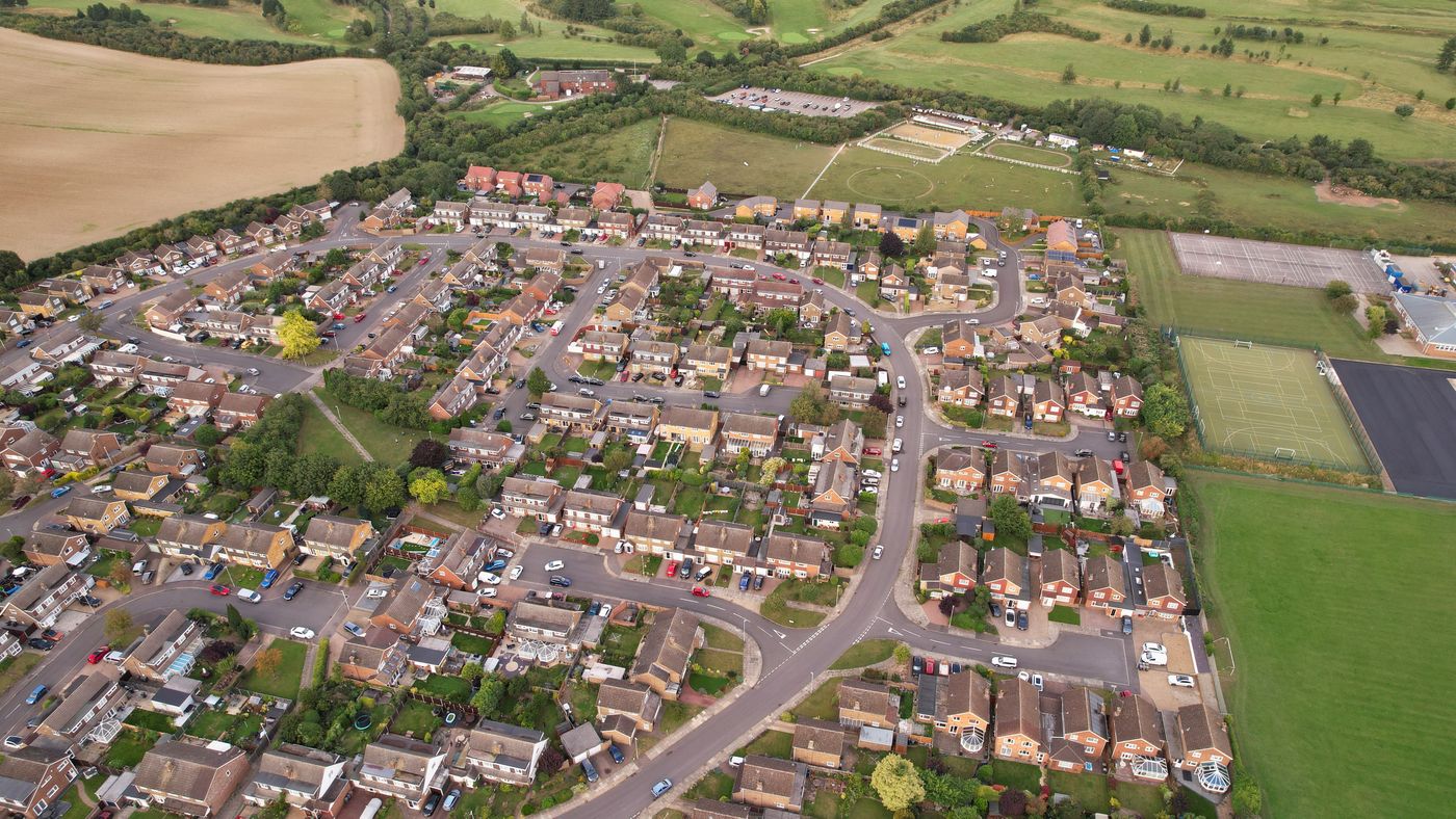 Aerial view of a residential area with premium homes surrounded by countryside near Newcastle NSW