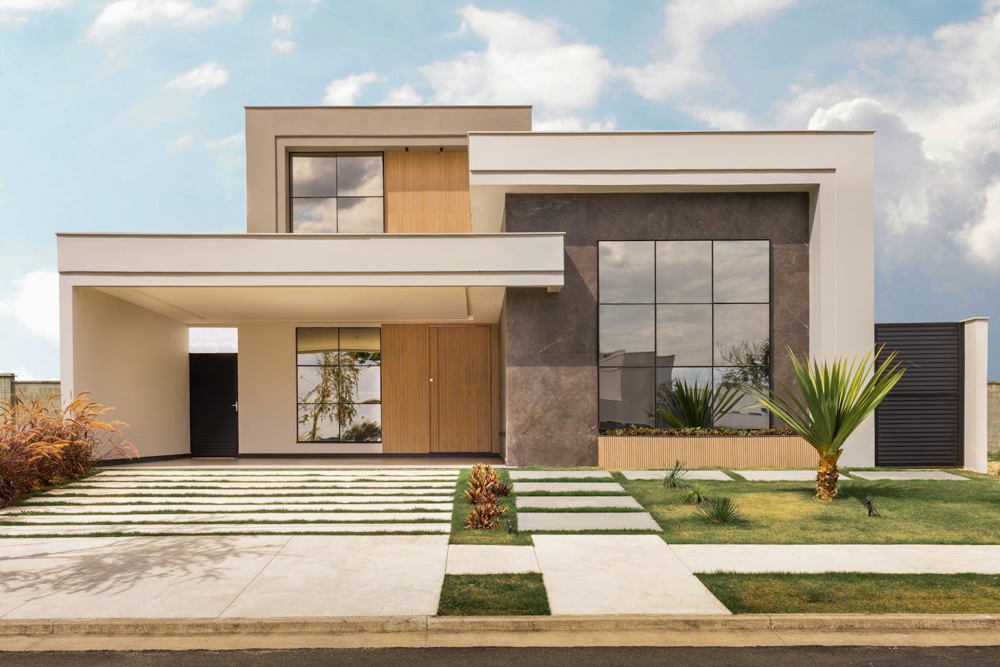 Contemporary new home exterior with minimalist design and landscaped front yard